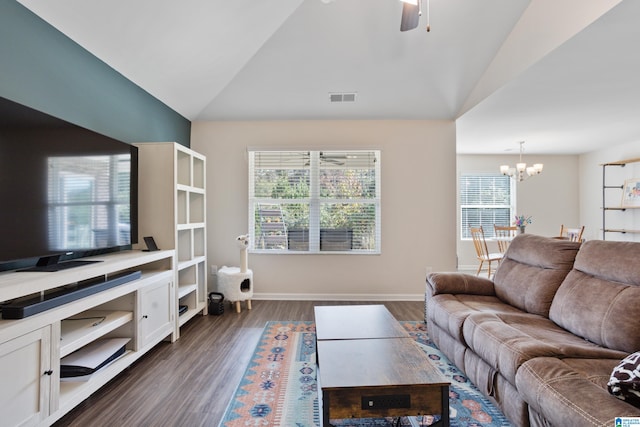 living room with dark hardwood / wood-style floors, plenty of natural light, and vaulted ceiling