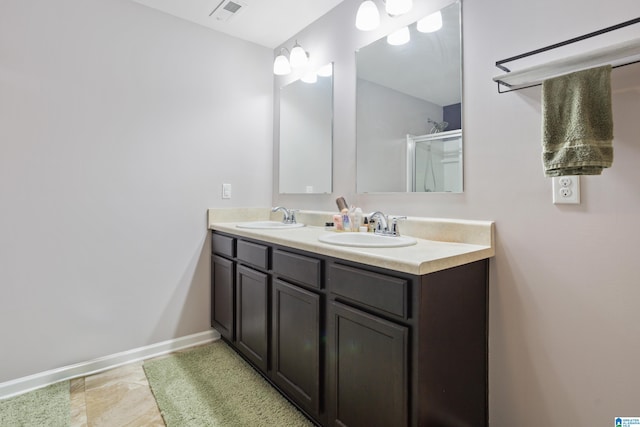 bathroom with walk in shower and vanity