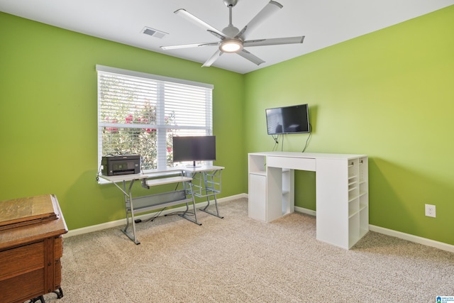 office with light carpet and ceiling fan