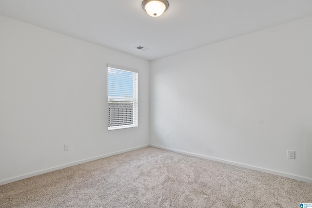 spare room featuring carpet floors