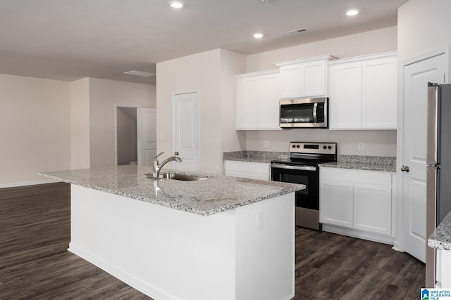 kitchen with sink, dark wood-type flooring, a kitchen island with sink, stainless steel appliances, and white cabinets