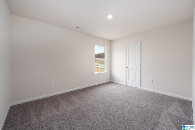 spare room featuring carpet flooring