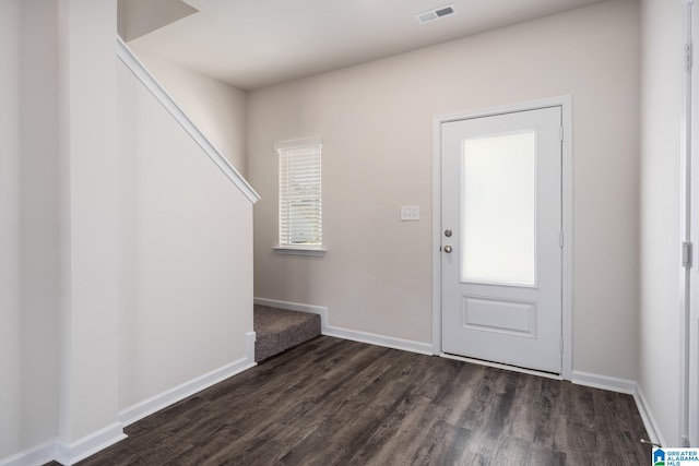 foyer with dark hardwood / wood-style flooring