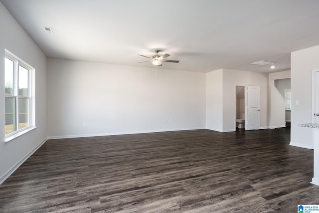 unfurnished room featuring ceiling fan and dark hardwood / wood-style flooring