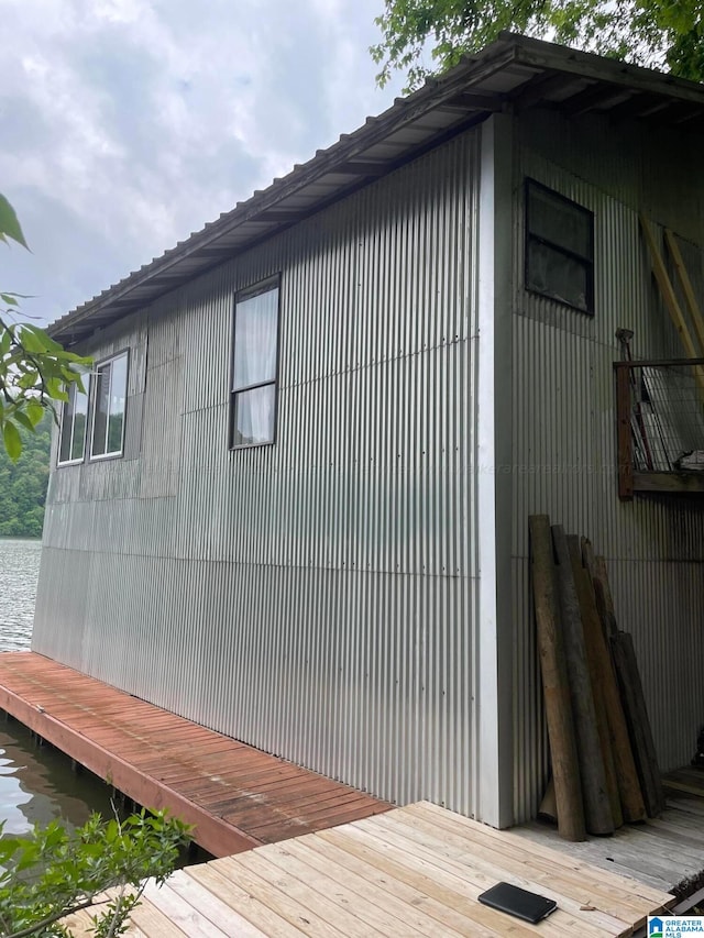 view of side of home featuring a wooden deck