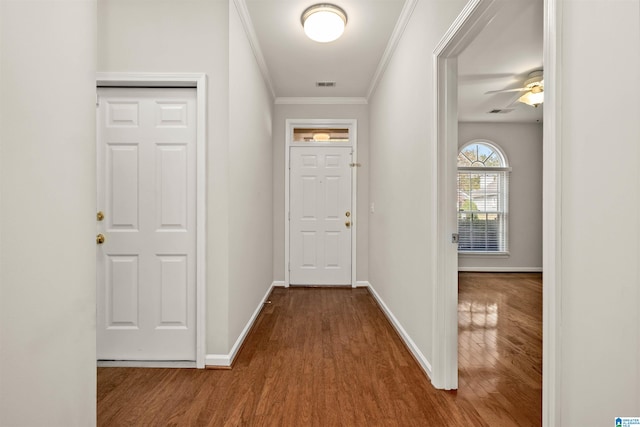 corridor featuring hardwood / wood-style floors and ornamental molding