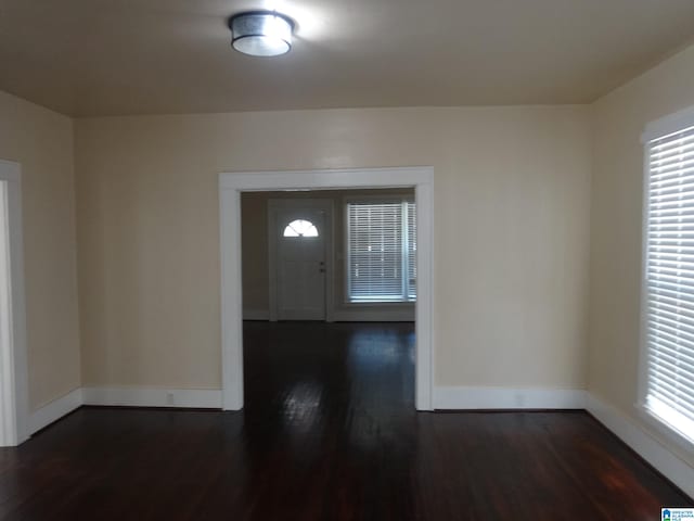 entryway with dark hardwood / wood-style floors