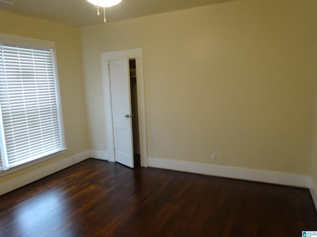 1317 SW 16th St SW, Birmingham, AL 35211 - empty room featuring dark wood-style flooring and baseboards