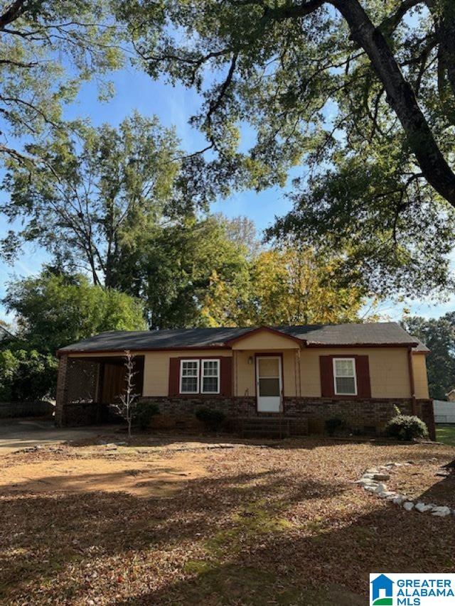 view of front of home featuring a carport