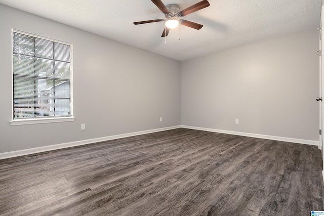 unfurnished room featuring ceiling fan, dark hardwood / wood-style floors, and a textured ceiling