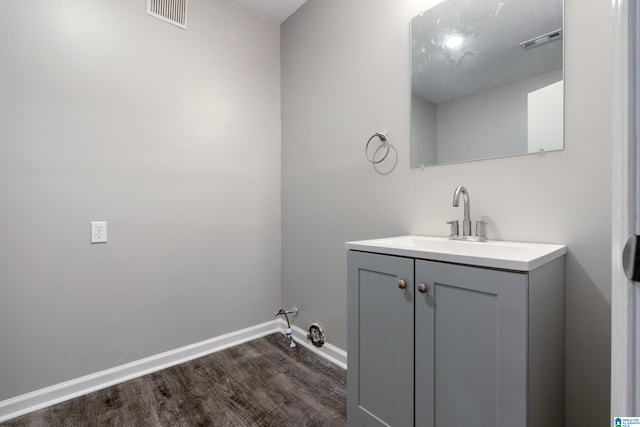 bathroom featuring vanity and wood-type flooring