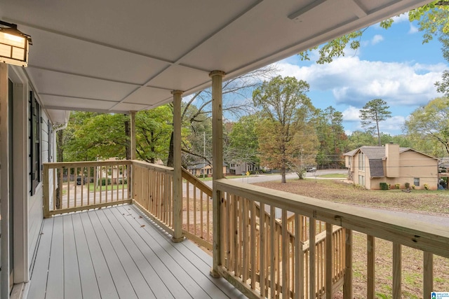 wooden terrace featuring covered porch