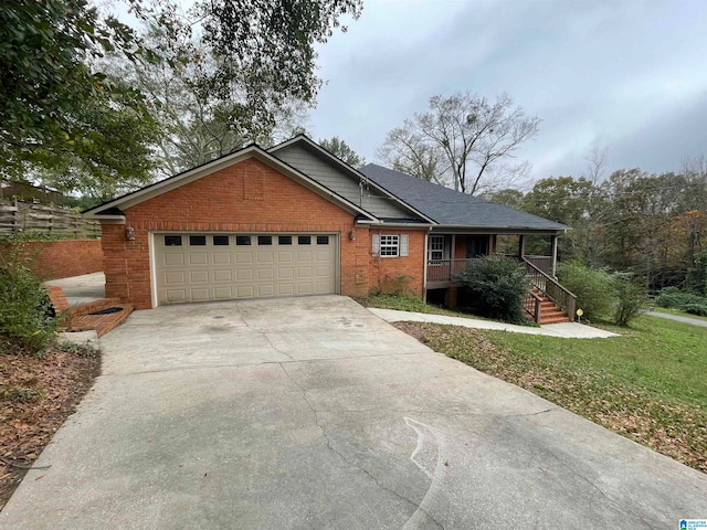 view of front of home featuring a garage and a porch