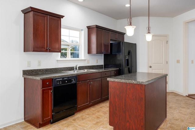 kitchen with pendant lighting, sink, black appliances, and a center island