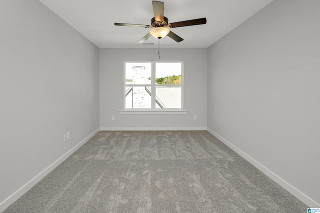 empty room featuring light carpet and ceiling fan