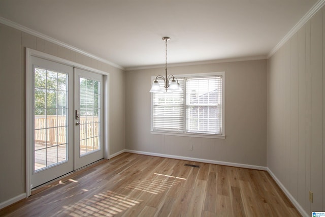 interior space with plenty of natural light, light hardwood / wood-style flooring, and ornamental molding