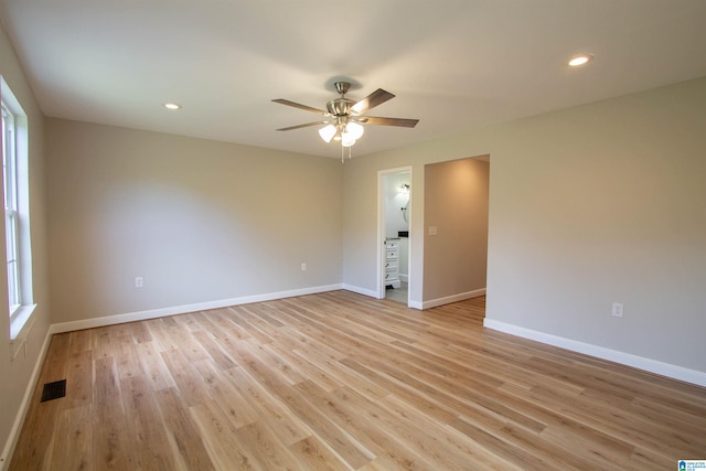 unfurnished room featuring light hardwood / wood-style floors and ceiling fan