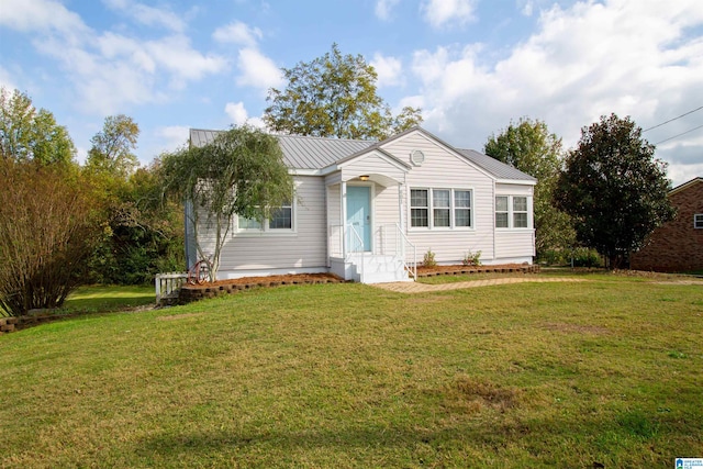 single story home featuring a front yard