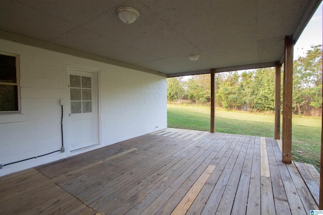 wooden deck featuring a yard