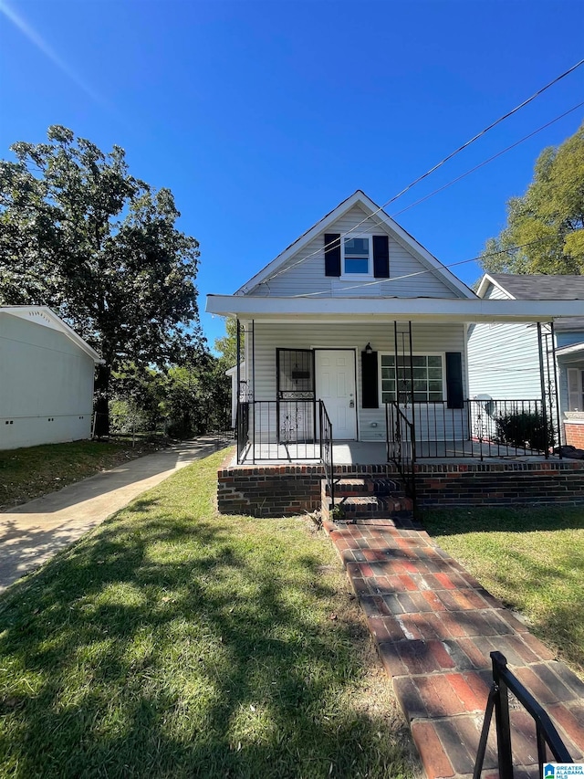 bungalow with a front yard