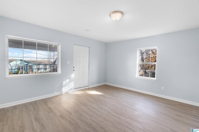 unfurnished room featuring wood-type flooring