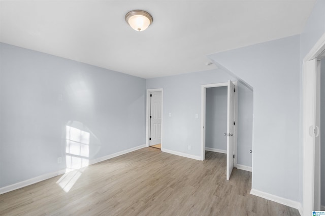 interior space with light wood-type flooring and a closet