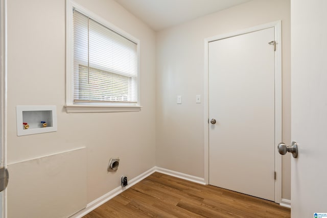 laundry area with light wood-type flooring and washer hookup