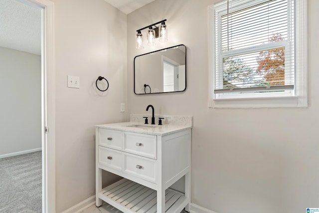 bathroom featuring vanity and a textured ceiling