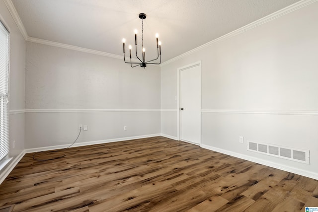 unfurnished dining area featuring a wealth of natural light, a chandelier, dark hardwood / wood-style floors, and crown molding