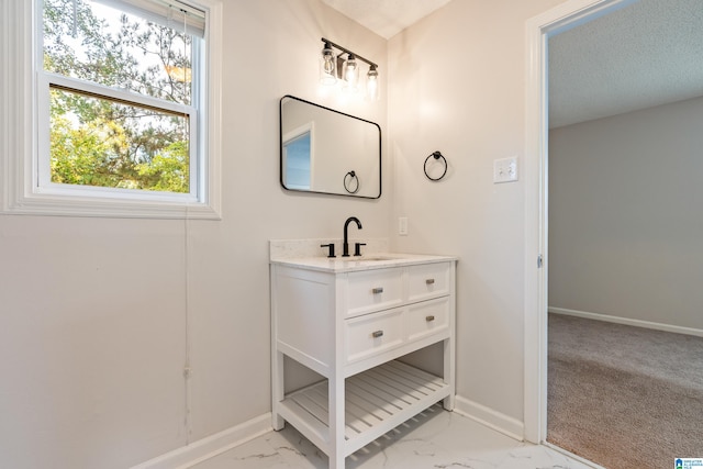 bathroom featuring vanity and a textured ceiling