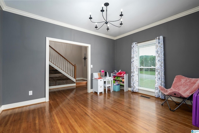 interior space with hardwood / wood-style flooring, crown molding, and a notable chandelier