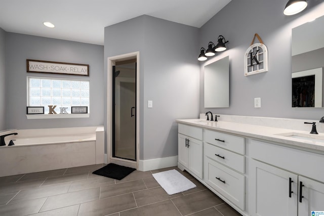 bathroom featuring vanity, tile patterned floors, and plus walk in shower