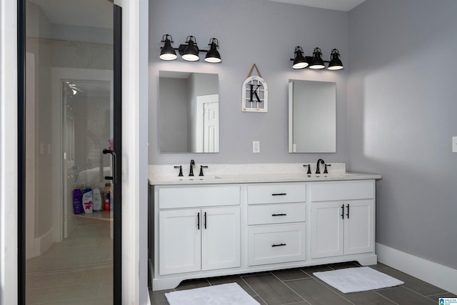 bathroom featuring walk in shower, tile patterned flooring, and vanity