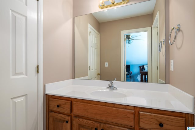 bathroom featuring ceiling fan and vanity