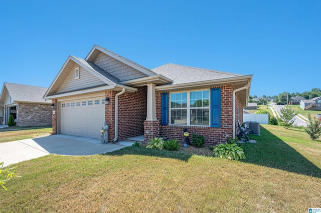 view of front of property featuring a garage, a front yard, and central AC