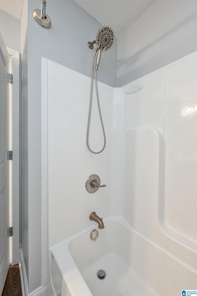 bathroom with shower / washtub combination