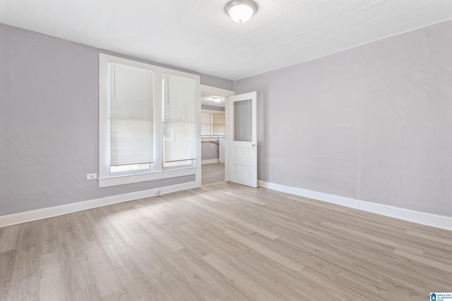 spare room featuring light hardwood / wood-style floors