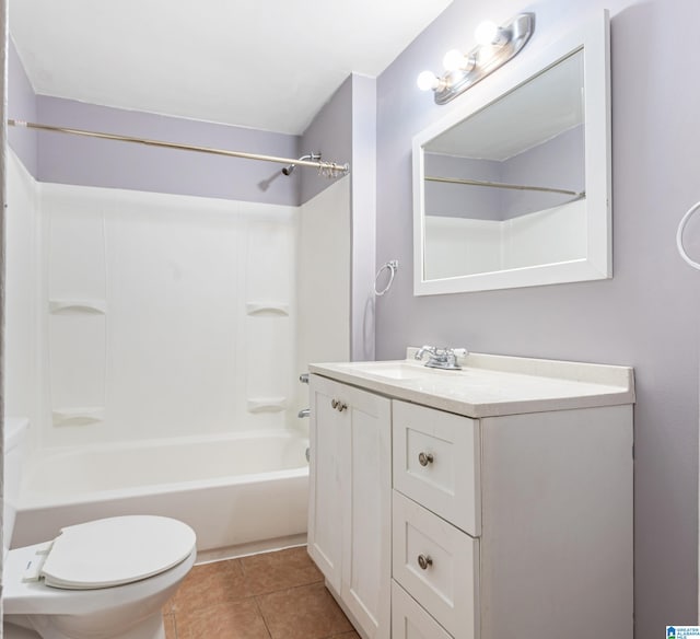 full bathroom with vanity, washtub / shower combination, tile patterned floors, and toilet