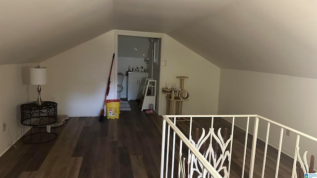 bonus room featuring lofted ceiling and dark hardwood / wood-style floors