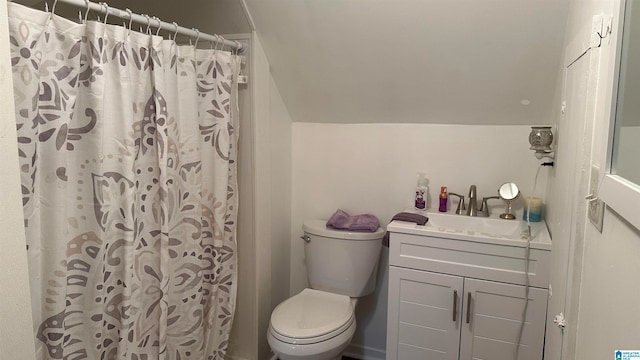 bathroom featuring walk in shower, vanity, and toilet