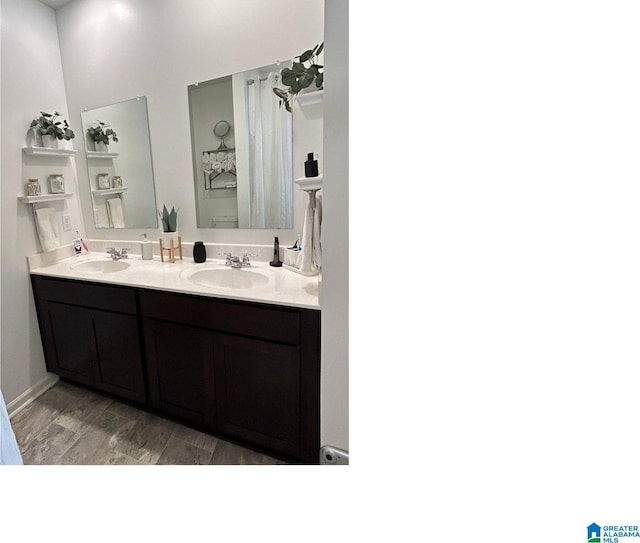 bathroom with hardwood / wood-style floors and vanity