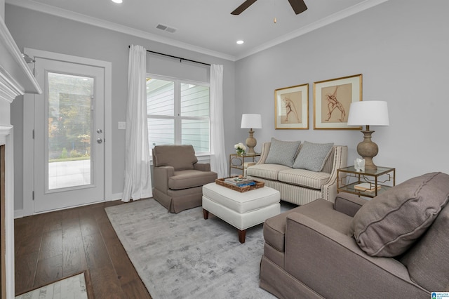 living room with hardwood / wood-style floors, ornamental molding, a healthy amount of sunlight, and ceiling fan