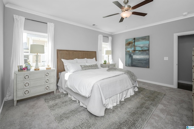 carpeted bedroom featuring multiple windows, ceiling fan, and ornamental molding