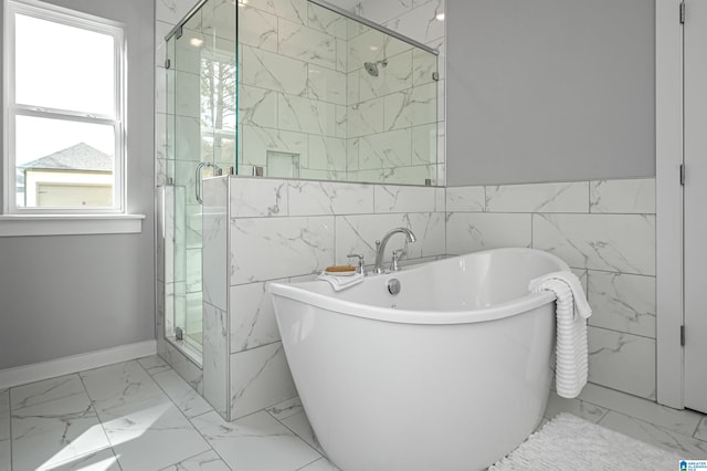 bathroom with separate shower and tub, plenty of natural light, and tile walls