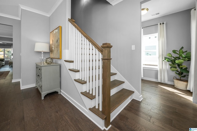 stairs with wood-type flooring and ornamental molding