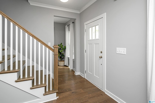 foyer entrance featuring dark hardwood / wood-style floors and crown molding