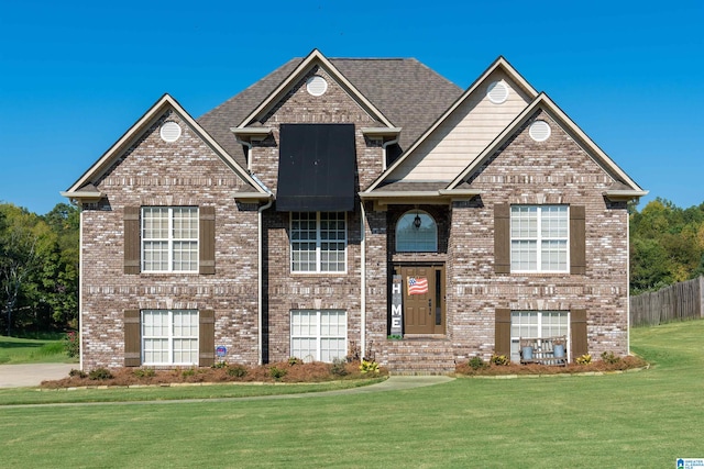 view of front of home featuring a front yard