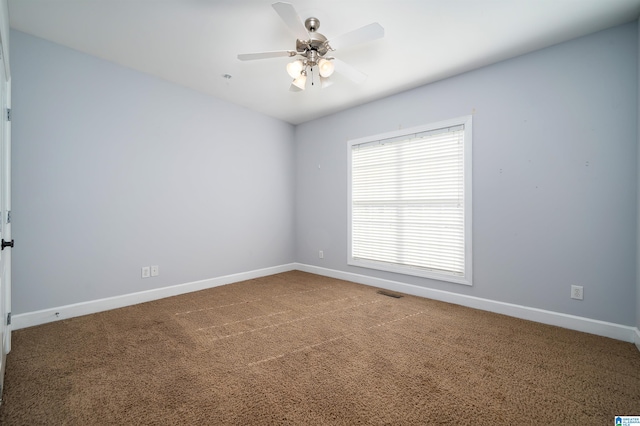 carpeted empty room with ceiling fan