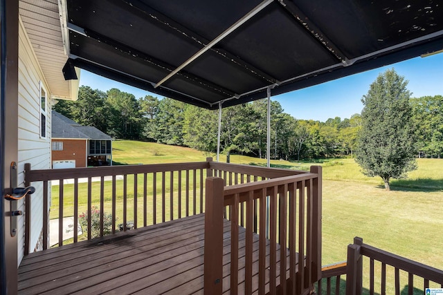 wooden terrace with a lawn