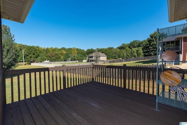 wooden deck featuring a yard